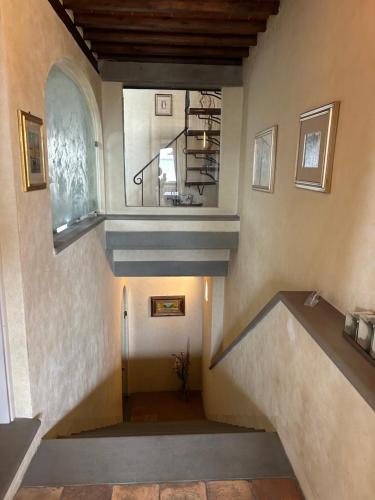 a hallway with a staircase in a house at La Corte di Ronzano in Scarperia