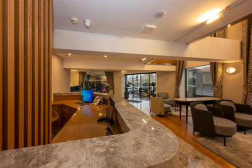 a kitchen and living room with a large counter top at Baver Hotel in Istanbul