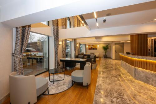 a lobby with a piano and a living room at Baver Hotel in Istanbul