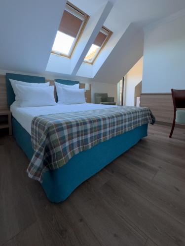 Una cama o camas en una habitación de Greno Hotel & Spa