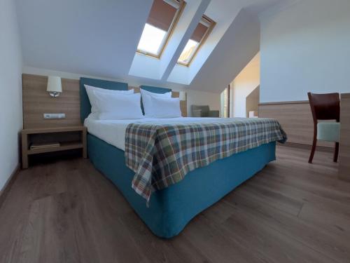 Una cama o camas en una habitación de Greno Hotel & Spa