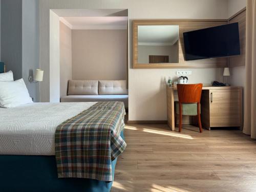 Una cama o camas en una habitación de Greno Hotel & Spa