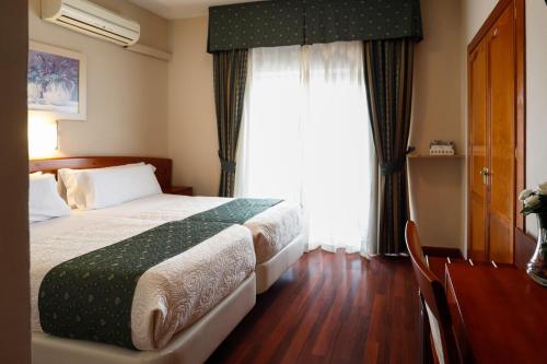 Hotel Alameda Málagaにあるベッド