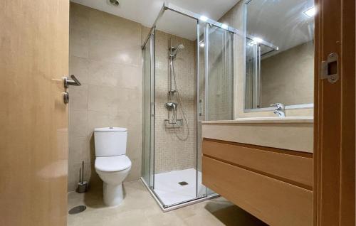 a bathroom with a shower and a toilet and a sink at Stunning Apartment In Rincn De La Victoria With Kitchen in Rincón de la Victoria