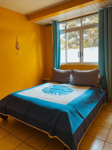 a bed in a room with a window at Villa Mitirapa in Tohautu