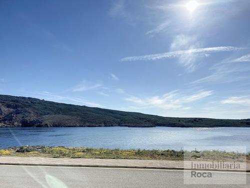 a view of a body of water next to a road at Roca Fornells, Apartamento en Tramontana F239 in Fornells