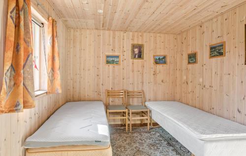 En eller flere senge i et værelse på 3 Bedroom Beautiful Home In Vordingborg