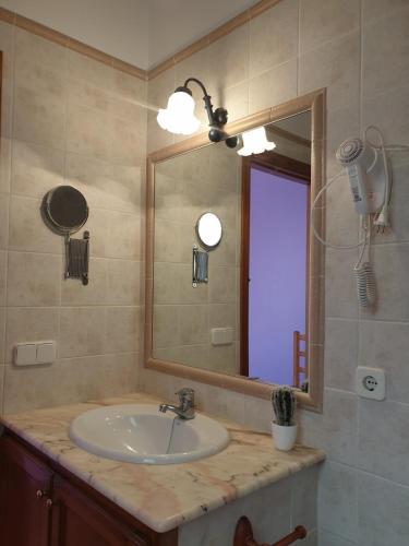 a bathroom with a sink and a mirror at F98. Vistas al mar en Fornells! in Fornells
