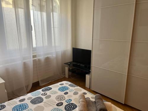 a person standing on a bed in a bedroom at DOWN TOWN STUDIO in Lausanne