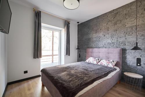 Postel nebo postele na pokoji v ubytování Apartament Sosnówka