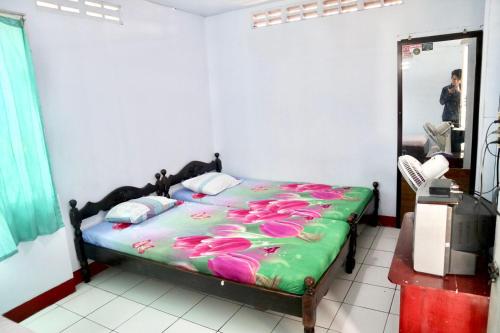 מיטה או מיטות בחדר ב-Hotel Kalingga 2