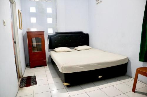 מיטה או מיטות בחדר ב-Hotel Kalingga 2