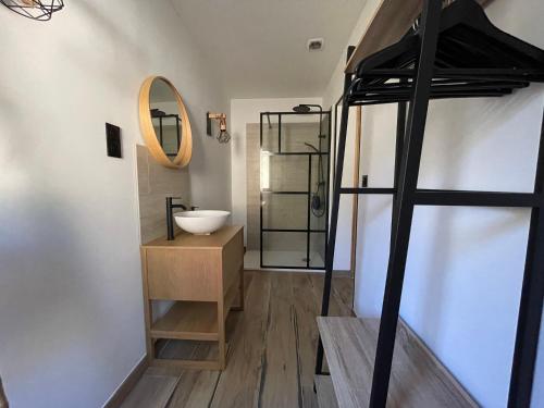 a bathroom with a sink and a mirror at Carpediem corsica adult only in Poggio-dʼOletta