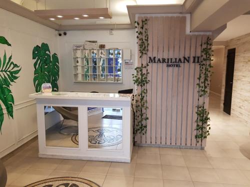 a dressing room with a white table in a store at Hotel Marilian II in Salta