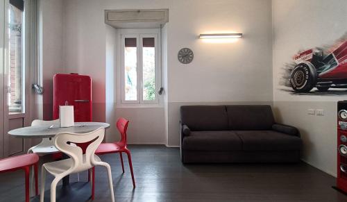 a living room with a table and a couch at SAHI - Residenza Bianca di Savoia in Milan
