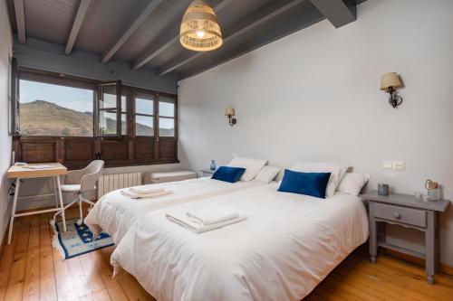 מיטה או מיטות בחדר ב-La quintana de sardeu