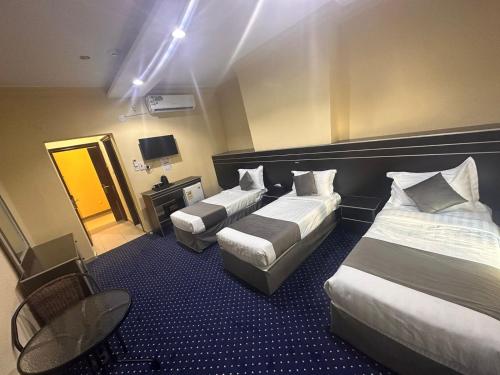 Кровать или кровати в номере فندق نسمات اليقين