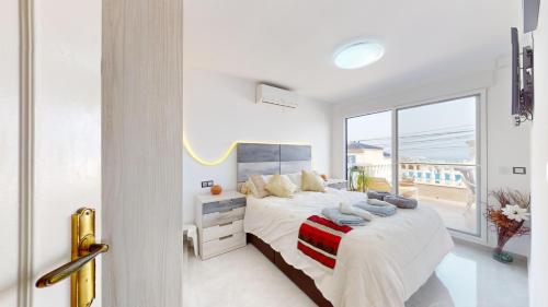 En eller flere senge i et værelse på Gran Alacant bungalow vistas al mar