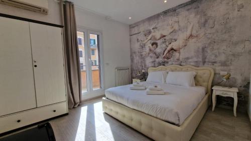a bedroom with a large bed with a stone wall at Major 93 Guesthouse in Rome