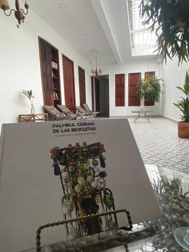 a bunch of wine bottles on display in a room at Hotel Boutique Iyarí in Palmira
