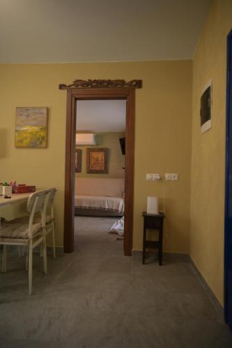 a room with a door leading to a bedroom at Villa Art Natalie in Kithnos