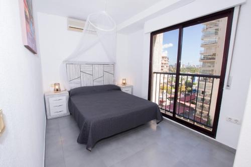A bed or beds in a room at Edificio Calpeplaya
