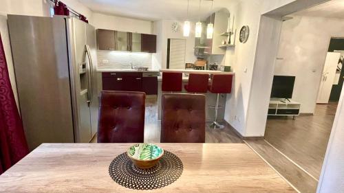 a kitchen with a table with a bowl of food on it at Haus am Soleweg in Ebensee