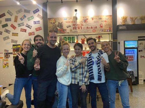 a group of people posing for a picture at Riverside International Youth Hostel阅江老院青年旅舍 in Chongqing