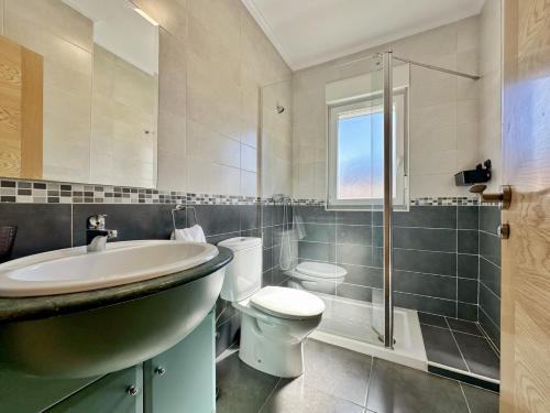 a bathroom with a sink and a toilet and a shower at Los Girasoles - 6806 in Noja