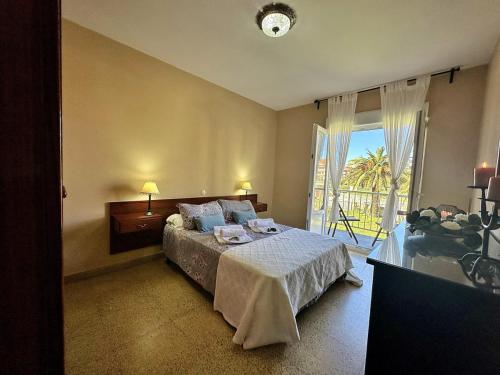 a hotel room with a bed and a balcony at La Esteluca - 6805 in Noja