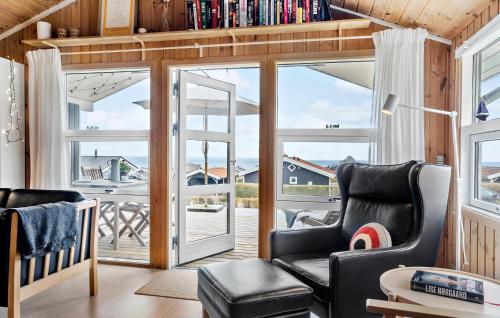 a tiny house with a view of the ocean at Stunning Home In Sjølund With Kitchen in Sjølund