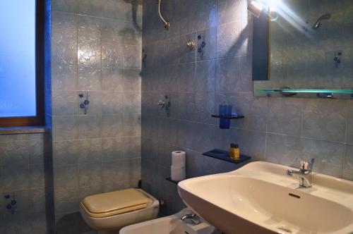 a bathroom with a sink and a toilet at B&B da Zia Rosa in Oliveto Citra