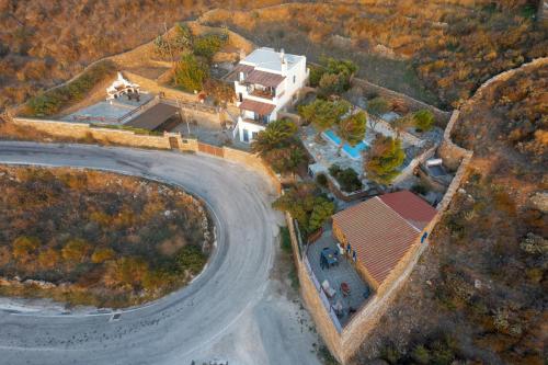 an overhead view of a house and a road at Villa Art Natalie in Kithnos