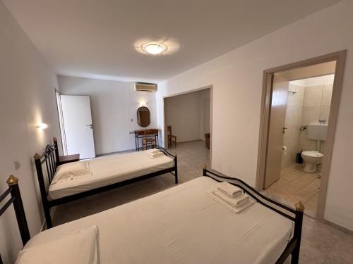 A bed or beds in a room at Sfinias Apartments
