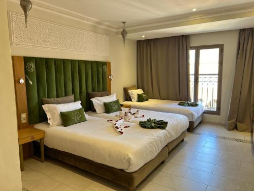 Postel nebo postele na pokoji v ubytování Diwane Hotel & Spa Marrakech