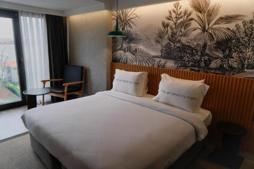 Ένα ή περισσότερα κρεβάτια σε δωμάτιο στο Zimmer Bosphorus Hotel
