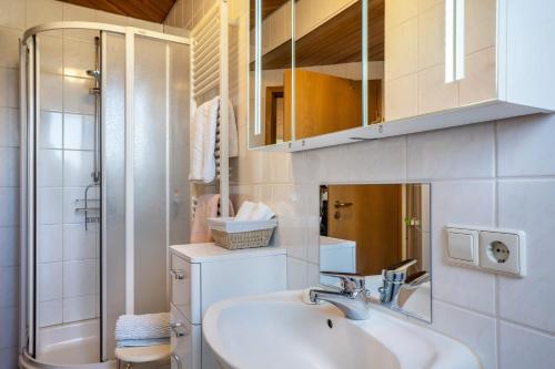 a bathroom with a sink and a shower at Jorchenhof in Hofstetten