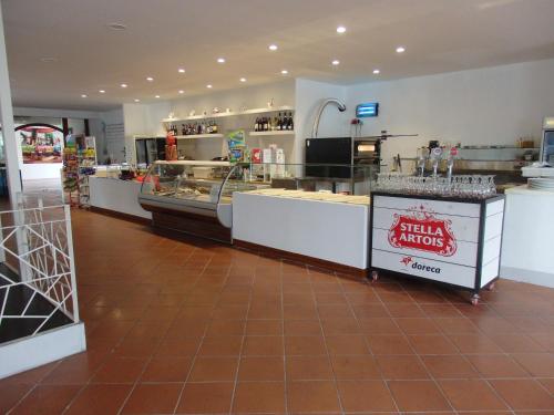 a store with a counter in the middle of a room at Camping Village la Chiocciola in Capannole