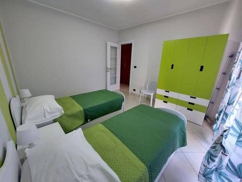Postel nebo postele na pokoji v ubytování Gru House Family