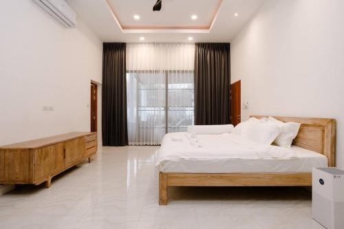 Ліжко або ліжка в номері Chang king villa