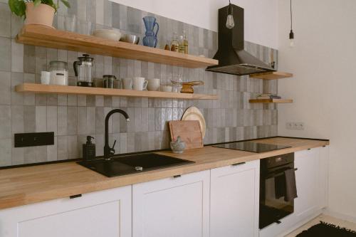 Kuchyň nebo kuchyňský kout v ubytování Alfreda