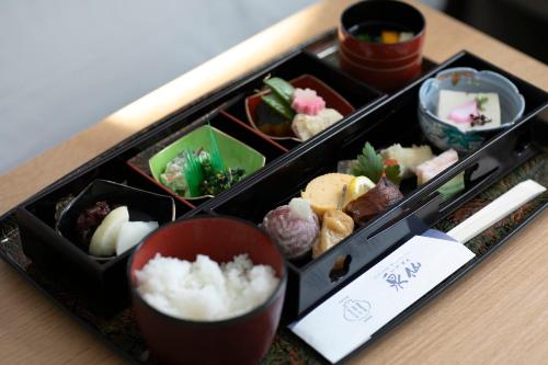 a tray of food on a table with sushi at ホテルトーイン京都 in Kyoto