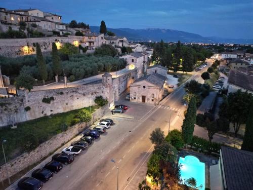 an aerial view of a city with cars parked on a street at Villamena in Spello