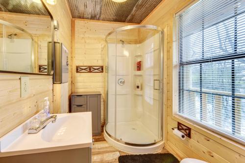 a bathroom with a shower and a sink at Waterfront Marksville Studio with Dock! in Marksville