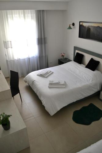 Postel nebo postele na pokoji v ubytování Dion Guest House