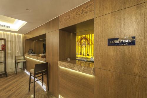 a lobby of a hotel with a sign on the wall at Le Bleu Hotel & Resort Kusadasi in Kusadası