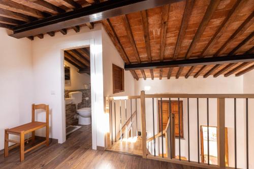 a hallway with a stairway leading to a bathroom at La Fortezza - Goelba in Marciana