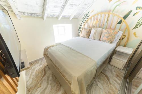 een slaapkamer met een bed in een kamer bij Sublime Hotel Boutique Cartagena in Cartagena