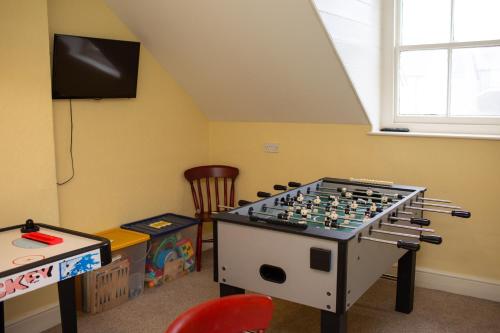 a room with a large chess set in the corner at Townhouse Aberystwyth in Aberystwyth