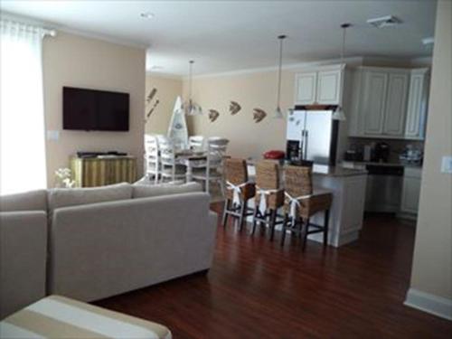 a living room and kitchen with a couch and a table at 16351 Hesser - 3br 2 Ba Home in Beach Haven Gardens